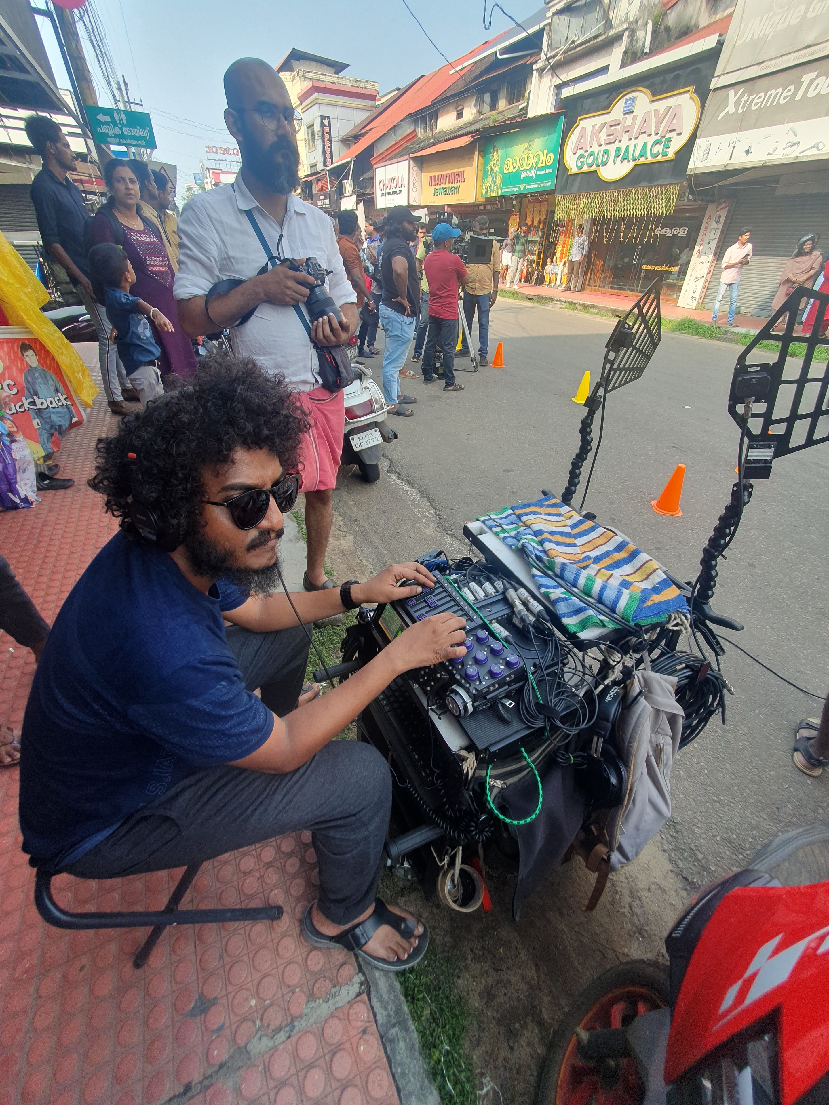 Sound engineer with headphones at audio equipment